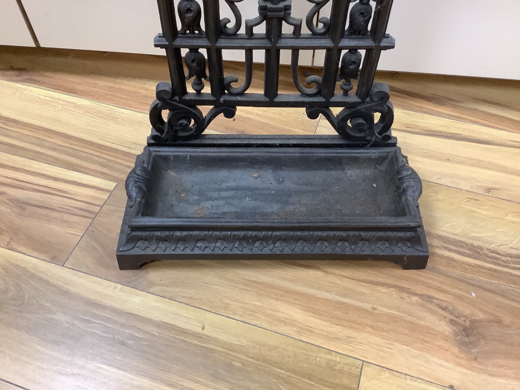 A cast iron umbrella stand